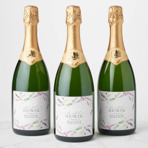 Elegant Wildflower Watercolor Floral Bridal Shower Champagne Label - A unique bridal shower champagne label, this trendy design features watercolor wildflower motifs in soft shades of blush pink, lilac and lavender, yellows, blues and delicate green botanical leaves. Personalize your bridal shower details in soft off-black, accented with beautiful modern hand lettered calligraphy. Part of a co-ordinated suite. See full collection here: https://www.zazzle.com/collections/elegant_wildflower_watercolor_floral_bridal_shower-119635760261893795 contact designer for additional products. Copyright Elegant Invites, all rights reserved.