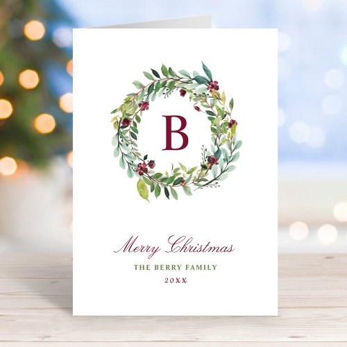 Elegant Winter Greenery Burgundy Monogram Wreath Holiday Card