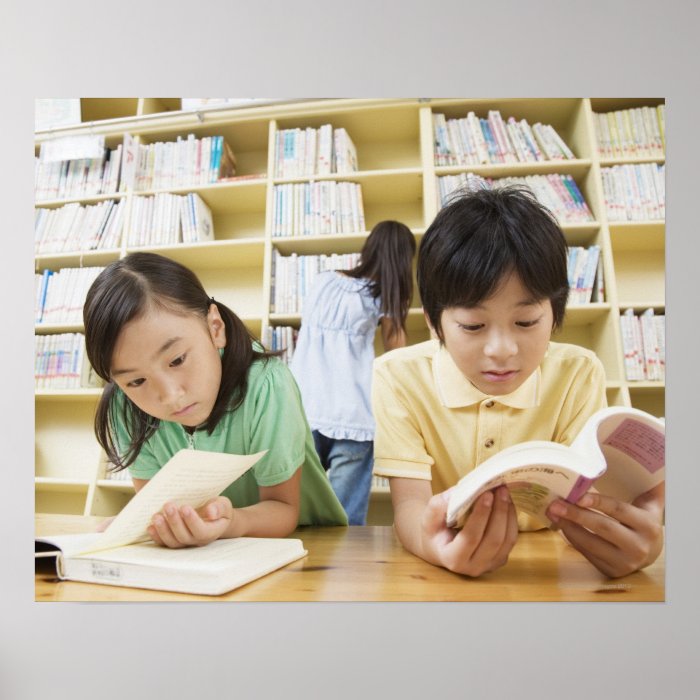 Elementary school students reading a book posters