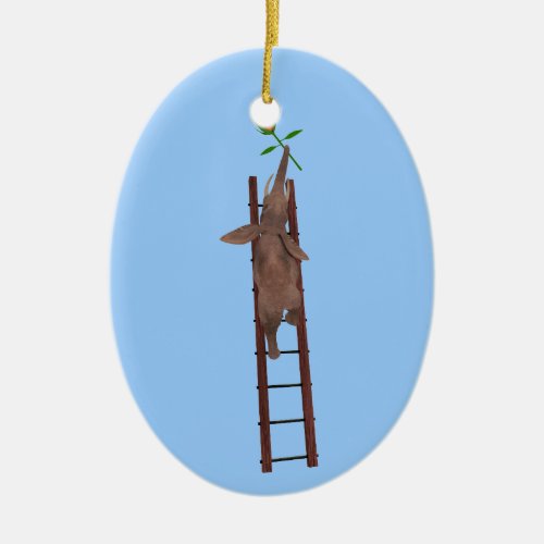 Elephant climbing a ladder ceramic ornament