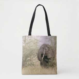 ELEPHANT EATING OFF A TREE TOTE BAG