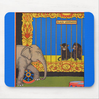 elephant strolling past the black leopards cage mouse pad