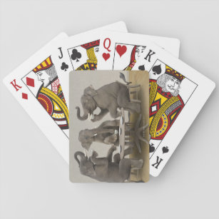 Elephants having tea party playing cards