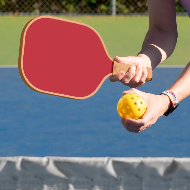 Elevate Your Design a Red Background and White  Carbon Fiber Pickleball Paddle (Insitu)