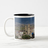 Elevated town view and Hotel Marques de Riscal Two-Tone Coffee Mug (Left)
