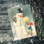 Elf and Snowman Vintage Christmas Card<br><div class="desc">Here's a cute Victorian era Christmas card with the image of one of Santa's elves holding a lighted candle up for a snowman to see. Fun to celebrate the Holidays the old fashioned way! Easily customize the inside message to suit your taste, or leave as is. For hundreds of vintage...</div>