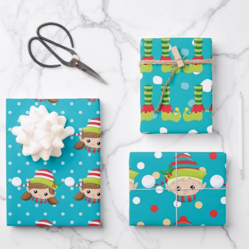 Elf boy girl faces feet on blue with snow pattern wrapping paper sheets