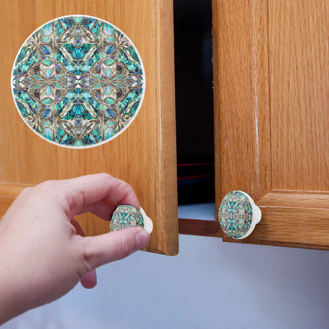 A light brown wooden cupboard with blue and white ornately printed doorknobs. 