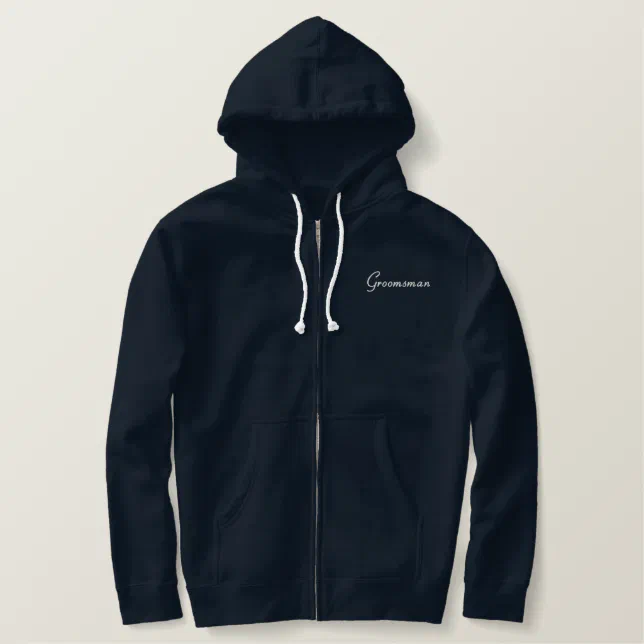 Simple navy hoodie with groomsman embroidered in white text.