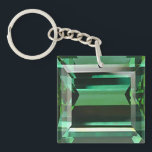 Emerald 3 keychain<br><div class="desc">Square double-sided acrylic keychain with an image, on both sides, of a sparkling emerald. See matching large square premium keychain, button, charm, necklace and wrist watch. See the entire Gemstones & Medallions Keychain collection in the ACCESSORIES section.</div>