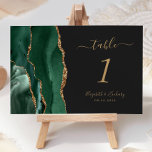 Emerald Green Gold Agate Dark Wedding Table Number<br><div class="desc">The left-hand edge of this elegant modern wedding table number card features an emerald green watercolor agate border trimmed with faux gold glitter. The customizable text combines gold-colored handwriting,  italic and copperplate fonts on an off-black background.</div>
