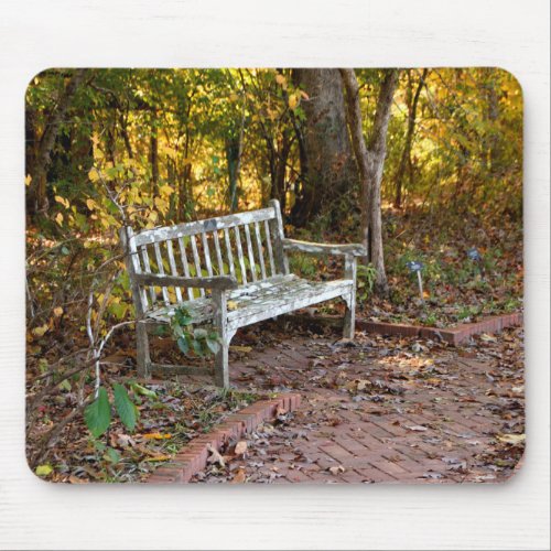 Empty bench chair at forest area mouse pad