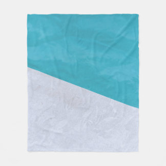 Empty gray floor beside pool fleece blanket