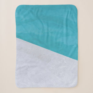 Empty gray floor beside pool sherpa blanket
