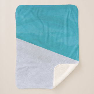 Empty gray floor beside pool sherpa blanket