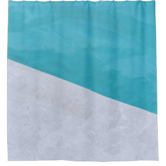 Empty gray floor beside pool shower curtain