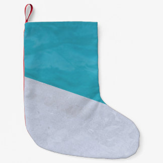 Empty gray floor beside pool small christmas stocking