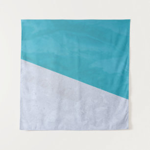 Empty gray floor beside pool tapestry