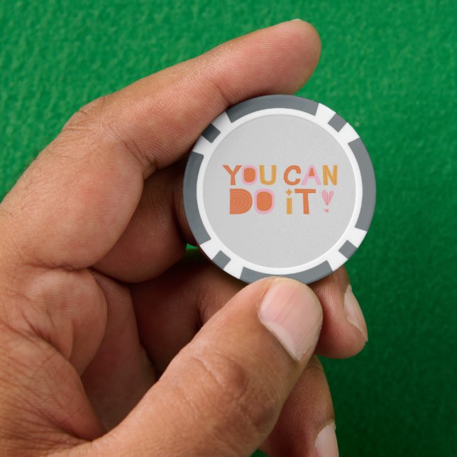 Encouragement text on gray poker chips (Hand)