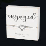 Engaged Heart Knot Modern Script Keepsake Wooden Box Sign<br><div class="desc">Modern and simple wooden box sign gift for a newly engaged couple! The typography text says "Engaged" in a script font. There is also an illustration of a rope tied in a heart knot. You can add the couple's names with a heart in-between and date on the bottom. Perfect way...</div>