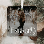 Engaged Minimalist Fun Typography Photo Metal Ornament<br><div class="desc">Celebrate your first holiday as an engaged couple with the Engaged Minimalist Fun Typography Photo Metal Ornament. This ornament combines clean, simple design with handwritten script and a stylish vintage Christmas aesthetic, perfect for adding a touch of elegance to your tree. Crafted from shatterproof metal, it’s both lightweight and durable,...</div>