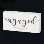 Engaged Modern Script Keepsake Wooden Box Sign<br><div class="desc">Modern and simple wooden box sign gift for a newly engaged couple! The typography text says "Engaged" in a script font. You can add the couple's names with a heart in-between and date on the bottom. Perfect way to celebrate a special couple's engagement.</div>