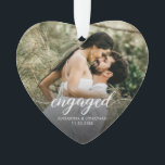Engaged Modern script Personalized photo keepsake Ornament<br><div class="desc">Celebrate your engagement with this beautiful custom photo heart ornament, designed to capture one of life’s sweetest milestones. Featuring your favorite photo with elegant script that reads “engaged”, this ornament makes a timeless keepsake for couples to cherish year after year. Personalize it with your names and engagement date to make...</div>