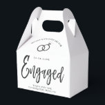 Engagement Party Script Lettering | Round Paper Co Favor Boxes<br><div class="desc">A fun and unique script-lettered paper gable box tailored specifically to your future engagement party. It features the word "engaged" with wedding rings resting over it. Underneath this and above it are the names of the bride and groom and the engagement date. Towards the bottom of the front of the...</div>