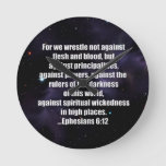 Ephesians 6:12 Bible Verse On Space Background Round Clock at Zazzle