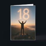 Epic 18th Birthday Mountain Sunrise  Card<br><div class="desc">Celebrate turning 18 with a card that feels like the start of an epic adventure. This striking design features the silhouette of a young man standing triumphantly on a rocky mountain peak at sunrise, arms raised in victory as the glowing number “18” appears in the sky like illuminated clouds. The...</div>