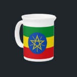 Ethiopia Flag Pitcher<br><div class="desc">This Ethiopia Flag Pitcher is a striking piece that combines practicality with a celebration of national pride. Featuring the vibrant green, yellow, red, and blue colors of the Ethiopian flag, this pitcher is perfect for serving beverages at home or during special occasions. The iconic flag design adds a meaningful touch...</div>