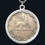 Ethiopian coin necklace<br><div class="desc">featuring the image of the Lion of Judah--please note that it is not an actual coin but the image of a coin printed on a flat surface</div>