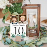 Eucalyptus 2 Photo Wedding Table Number Sign<br><div class="desc">Elegant wedding table number signs personalized with two photos, names of the bride and groom and accented with watercolor eucalyptus leaves. Include various photos of the couple through the years or their engagement pictures for an entertaining table sign for wedding guests. Fun to have similar age photos on the same...</div>