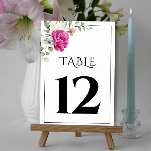 Eucalyptus branch with pink rose flowers wedding table number