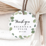 Eucalyptus Calligraphy Thank You Wedding Favor Classic Round Sticker<br><div class="desc">This eucalyptus calligraphy thank you wedding favor classic round sticker is perfect for a rustic wedding. The design features hand-drawn botanical green eucalyptus branches and leaves. Make the sticker labels your own by including your names, the event (if applicable), and the date. These stickers can compliment a wedding reception, bridal...</div>