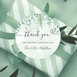 Eucalyptus greenery thank you wedding classic round sticker<br><div class="desc">A green watercolored background. Decorated with eucalyptus greenery and forest fern. With the text: Thank you for sharing our special day.   Personalize and add your names.</div>