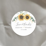 Eucalyptus Sunflower Floral Wedding Thank You Classic Round Sticker<br><div class="desc">Create modern Sunflower Floral multi-purpose labels with this cute template featuring beautiful rustic floral with green foliage thank you sticker

TIP: Matching wedding suite cards like RSVP,   wedding programs,  banners,  tapestry,  gift tags,  signs,  and other wedding keepsakes and goodies are available in the collection below featuring this design.</div>