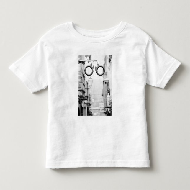Europe, Spain, Mallorca. Eyeglass shop sign, Toddler T-shirt (Front)