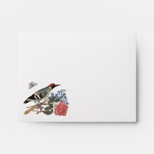 European green woodpecker on a branch with rose envelope