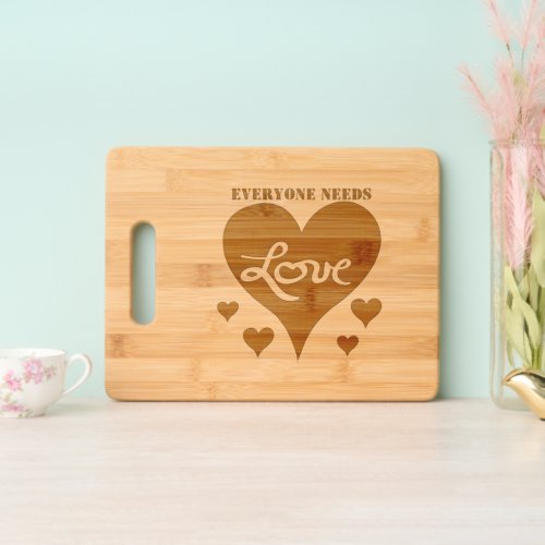 Everyone Needs Love Hearts Cutting Board