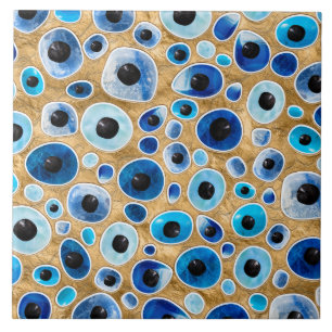 Evil Eye Pattern Tumbled Stones on gold Ceramic Tile