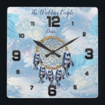 Exotic Blue Dream Catcher Home Decor Square Wall Clock<br><div class="desc">AA dream catcher that includes the round circle of bamboo and red beads in the web with blue exotic-parrot bird tone feathers on a soft blues feather background</div>