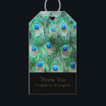 Exotic Peacock Feathers Thank You Gift Tags<br><div class="desc">A personalized thank you gift tag with a brightly colored pattern of exotic and wild peacock feathers in pretty teal, jewel green, aqua and cobalt blue. Artistic and fancy, created with watercolors. A chic and stylish design. Text is written in an elegant gold font and says Thank You with your...</div>