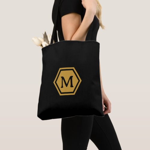 Experience Elegance with Black Gold Monogram Tote Bag