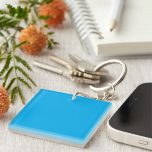 Experience the Beauty of a Blue Sky with a Plane Keychain