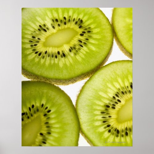 Extreme close_up of four pieces of sliced kiwi poster