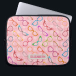Eyeglasses Retro Modern Hipster Pink Gingham Name Laptop Sleeve<br><div class="desc">This colorful, nerdy eyeglass novelty design laptop sleeve has an original pattern made up of spectacles in a variety of shades and styles, all on a background of retro pink gingham. The cool, girly glasses' frames range from 50s and 60s cat eye / horn rimmed and browline shapes to round,...</div>