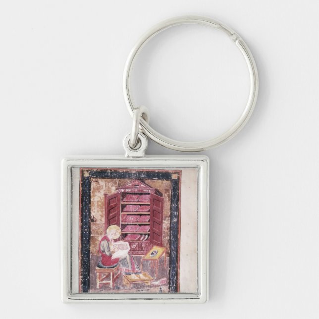 Ezra writing the sacred books keychain (Front)