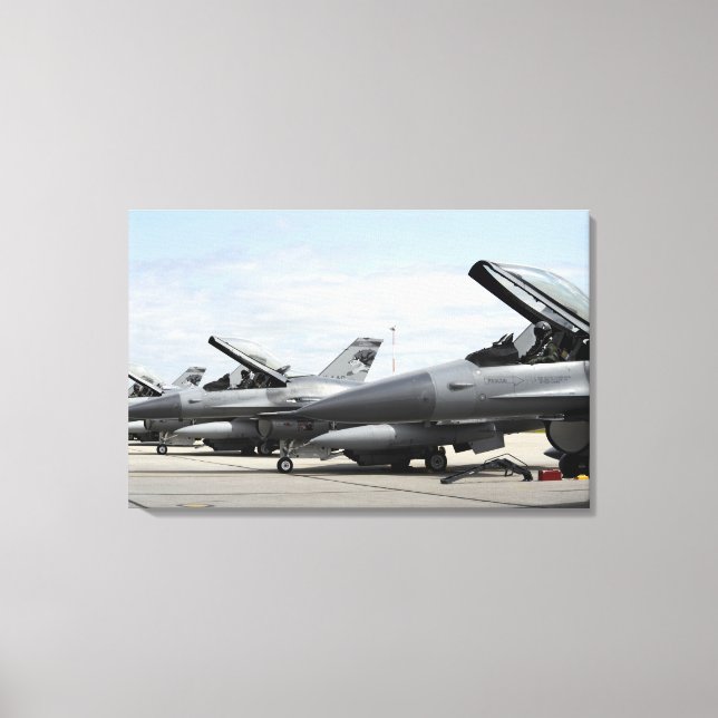 F-16 Fighting Falcons await to launch Canvas Print (Front)
