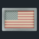 Faded American Flag Belt Buckle<br><div class="desc">Muted shades of red,  blue and cream give this American Flag belt buckle a rustic,  vintage feel. The design is from original art.</div>